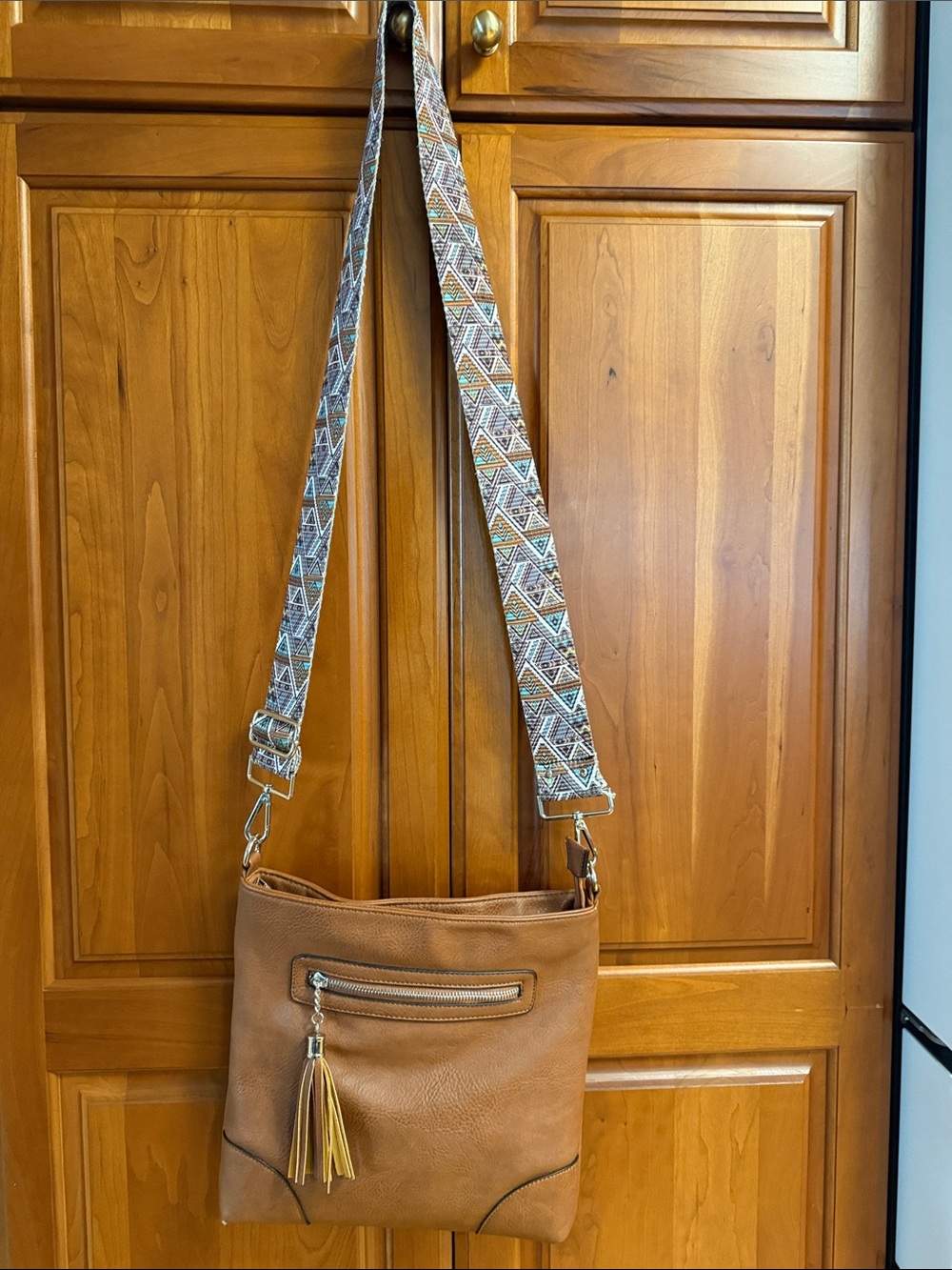 Stylish Brown Crossbody Bag with Patterned Strap